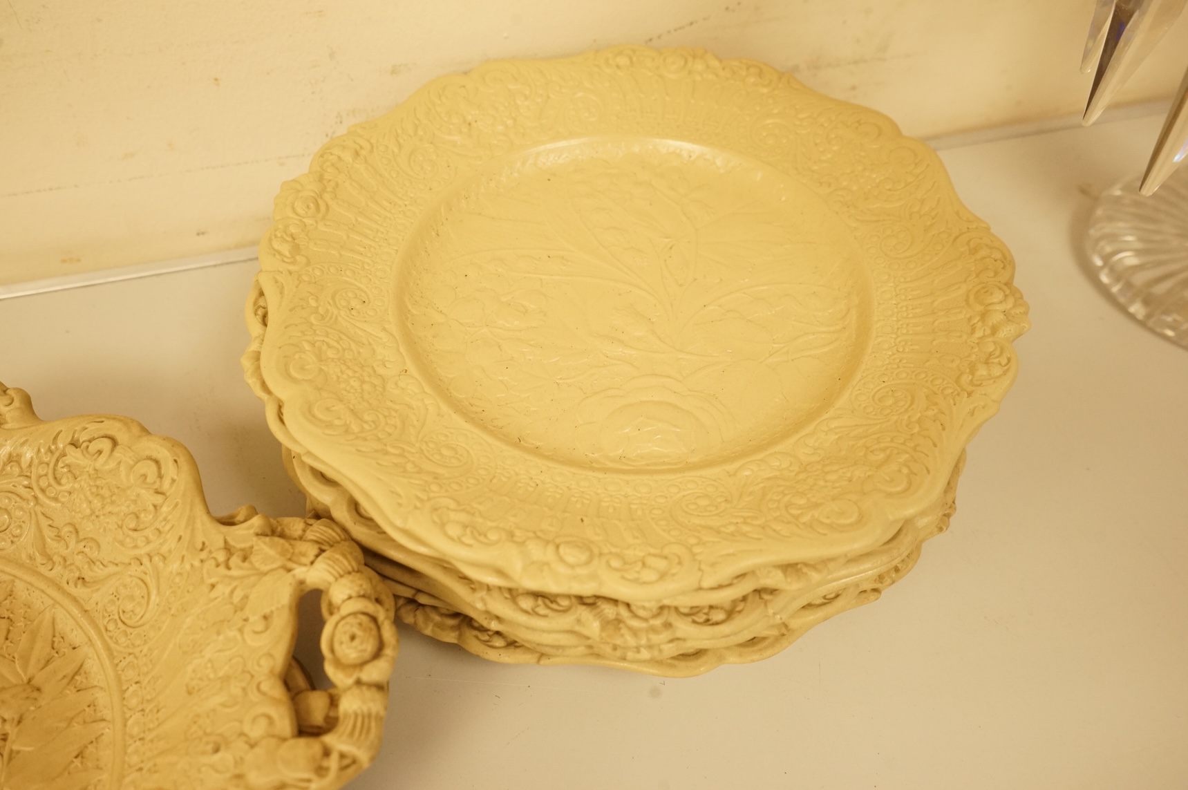 A Victorian drabware part dessert set, comprising eleven plates and three two handled dishes, dishes 25cm wide